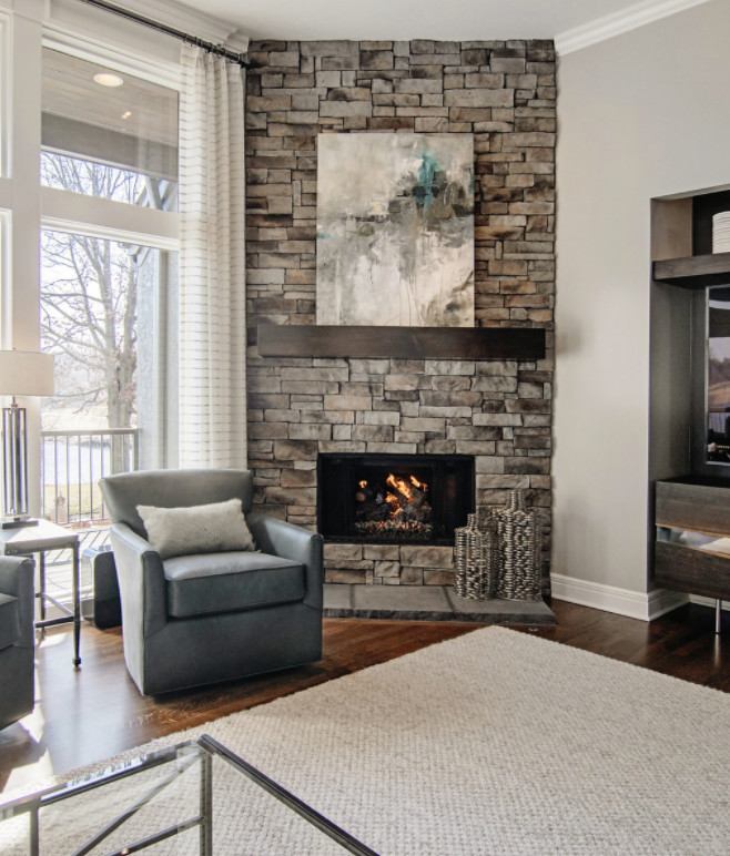 Inspiration for a mid-sized transitional formal and open concept dark wood floor living room remodel in Kansas City with gray walls, a corner fireplace, a stone fireplace and no tv
