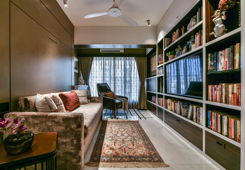 Medium sized world-inspired games room in Mumbai with brown walls, marble flooring, a wall mounted tv and white floors.