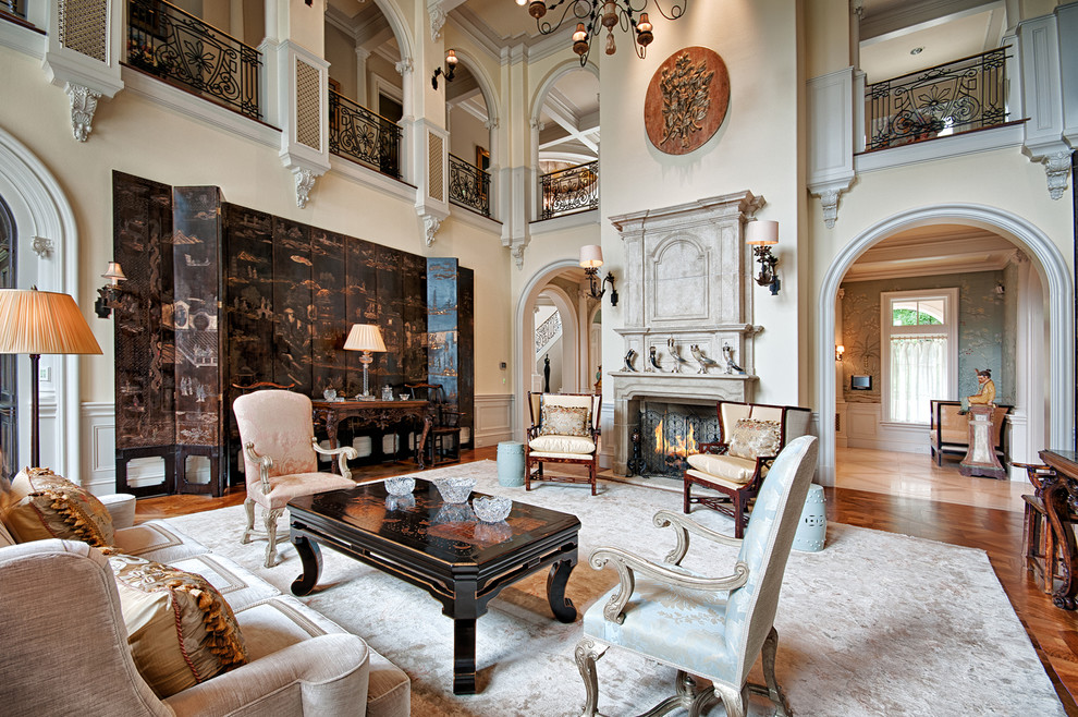 Inspiration for a victorian formal medium tone wood floor living room remodel in Other with beige walls, a standard fireplace and no tv