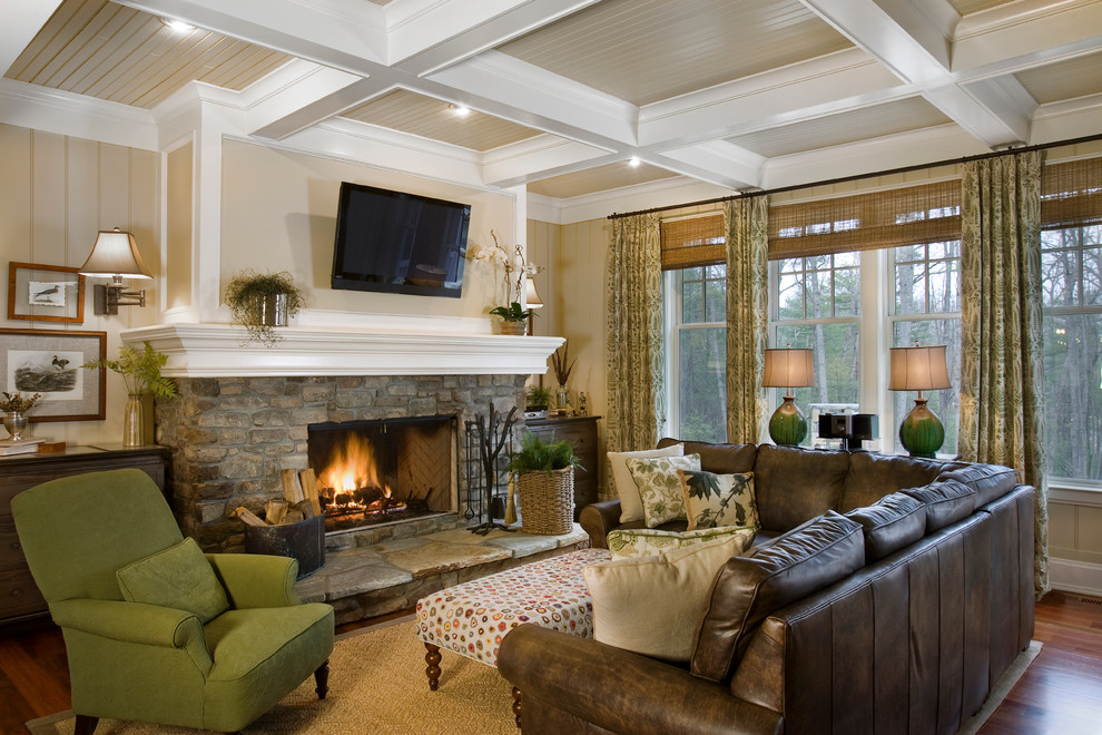 Design ideas for a traditional formal open plan living room in Other with dark hardwood flooring, a standard fireplace, a stone fireplace surround, a wall mounted tv and yellow walls.