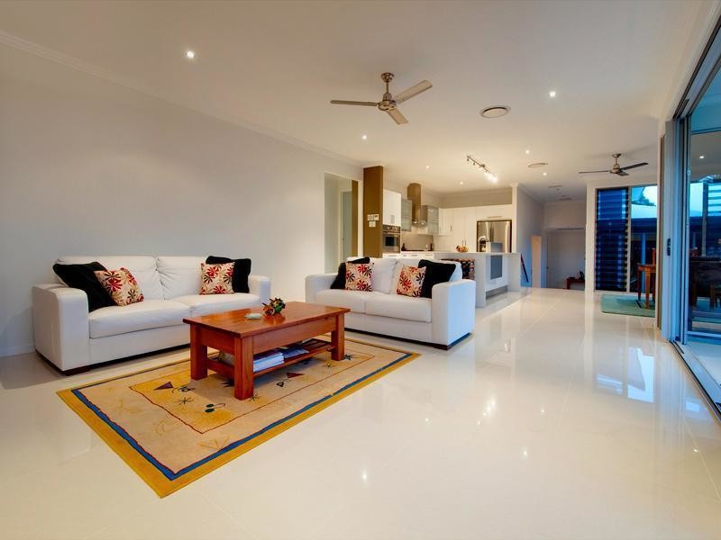 Inspiration for a medium sized modern open plan living room in Brisbane with porcelain flooring, no fireplace, a freestanding tv and beige floors.