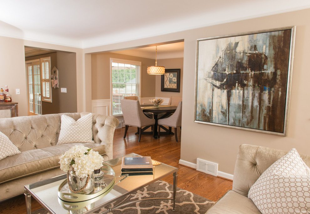Mid-sized elegant open concept medium tone wood floor living room photo in Detroit with beige walls