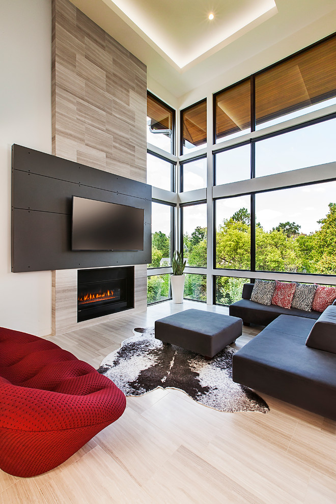 Inspiration for a mid-sized contemporary open concept light wood floor living room remodel in Detroit with a standard fireplace, a wall-mounted tv and beige walls