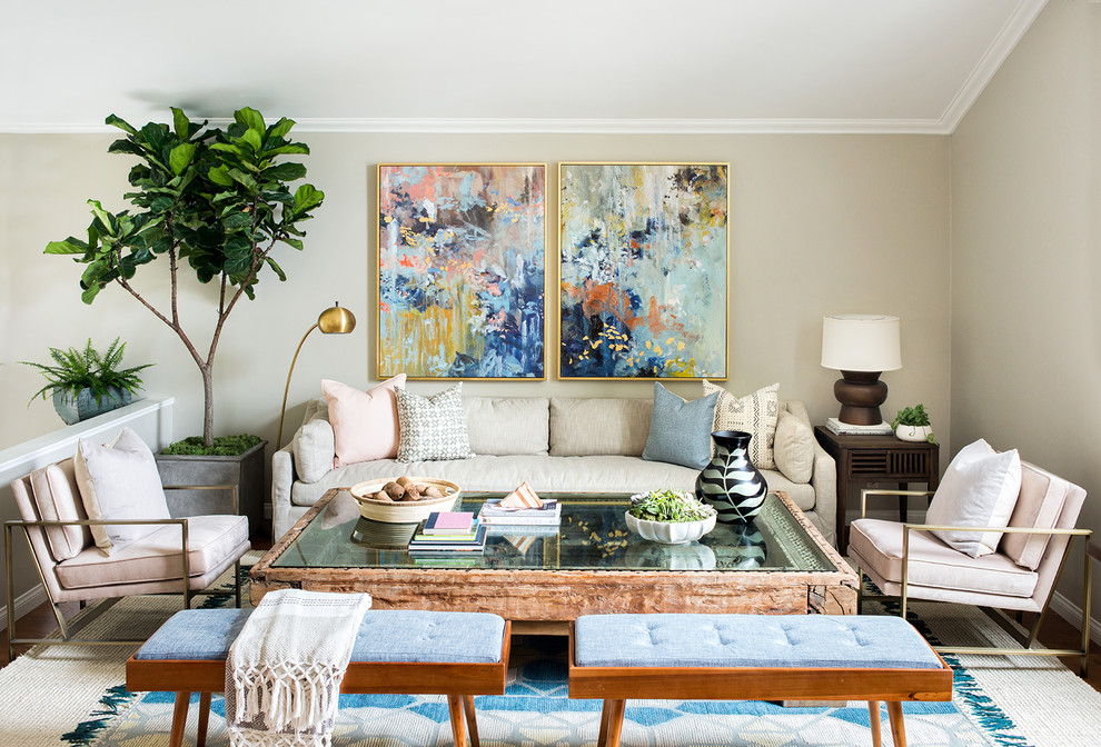 Eclectic living room in Los Angeles with beige walls, dark hardwood flooring, brown floors and feature lighting.