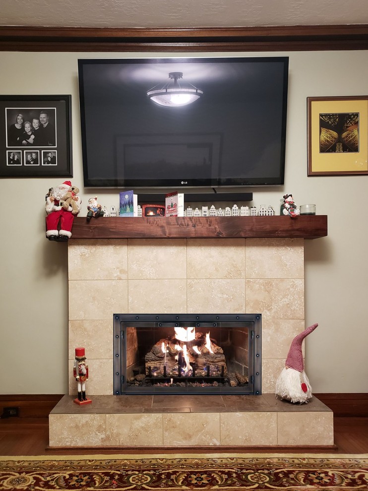 Bohemian living room in Orange County with a standard fireplace and a tiled fireplace surround.