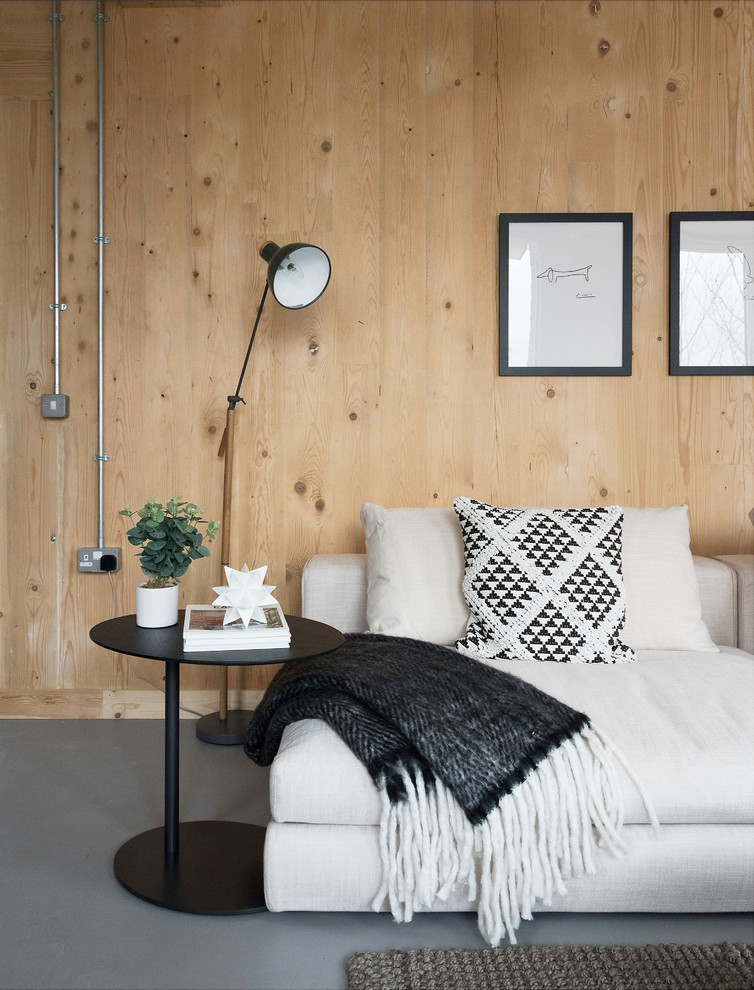 Ispirazione per un soggiorno contemporaneo con pareti beige e pavimento grigio
