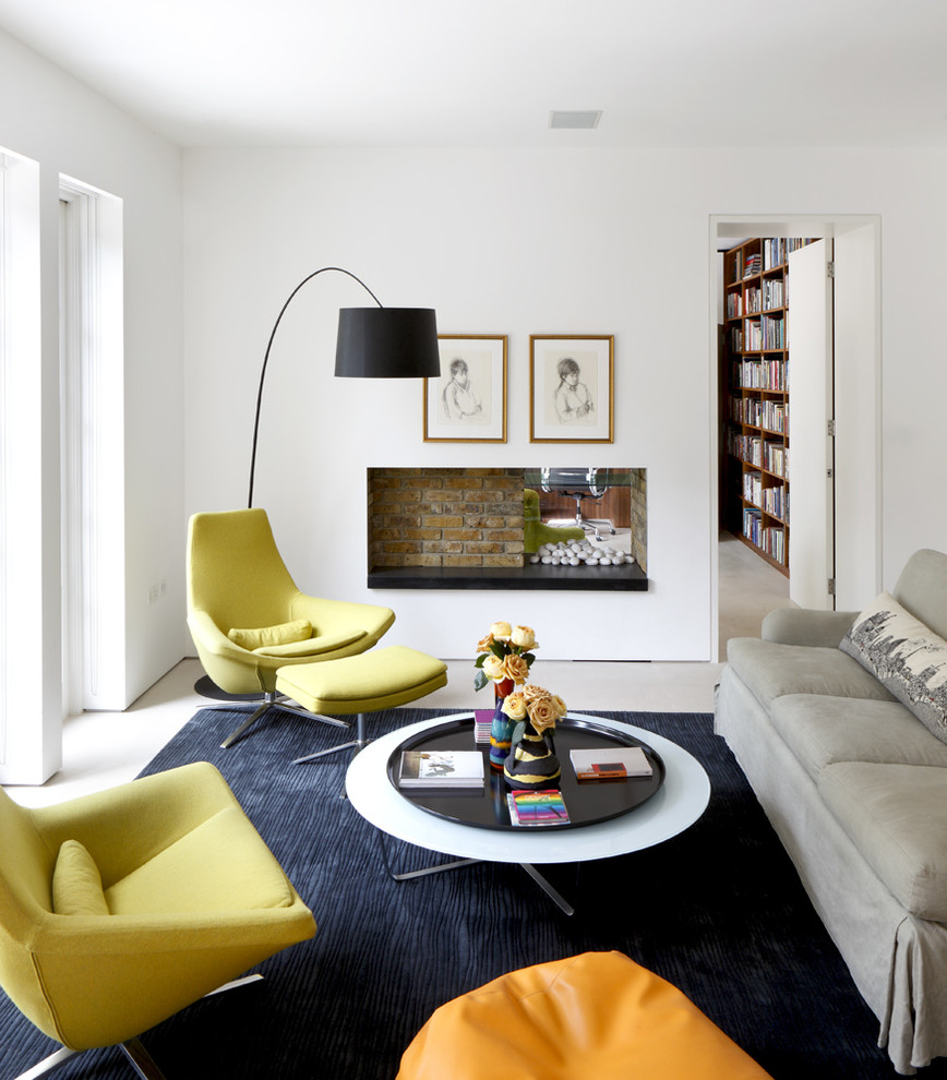 Design ideas for a small contemporary living room in London with white walls.