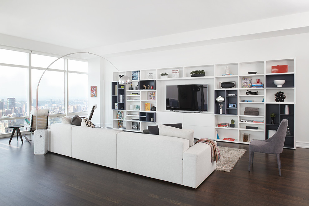 Inspiration for a large modern open concept dark wood floor and brown floor living room remodel in Other with white walls, a media wall and no fireplace