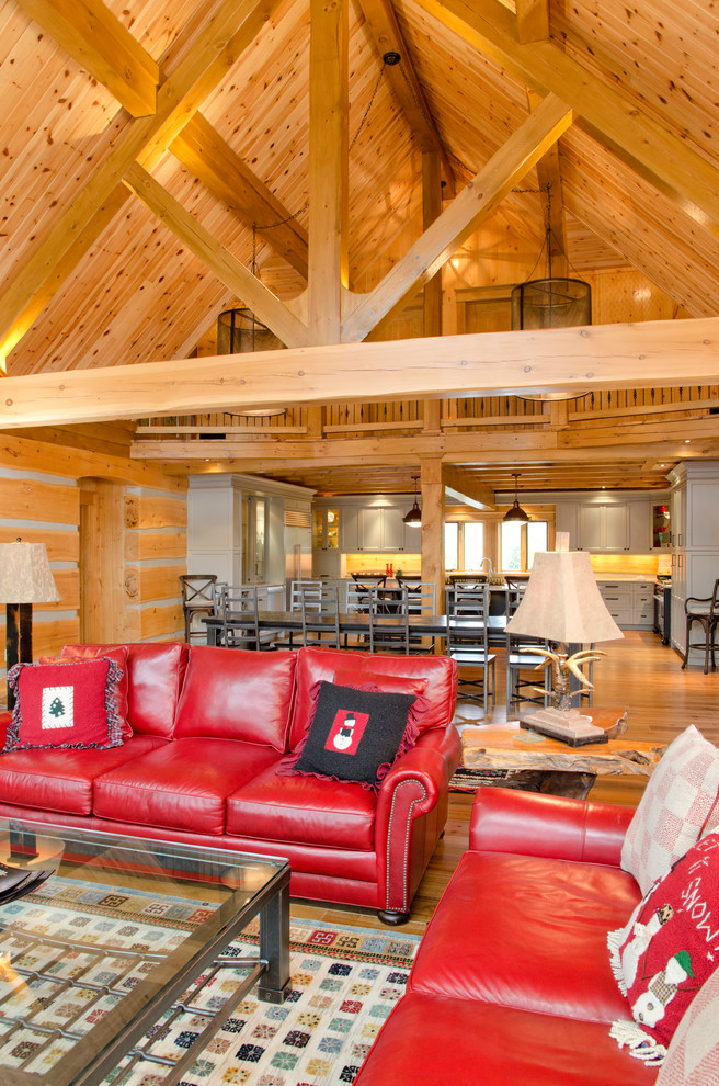This is an example of a rustic open plan living room in Toronto.
