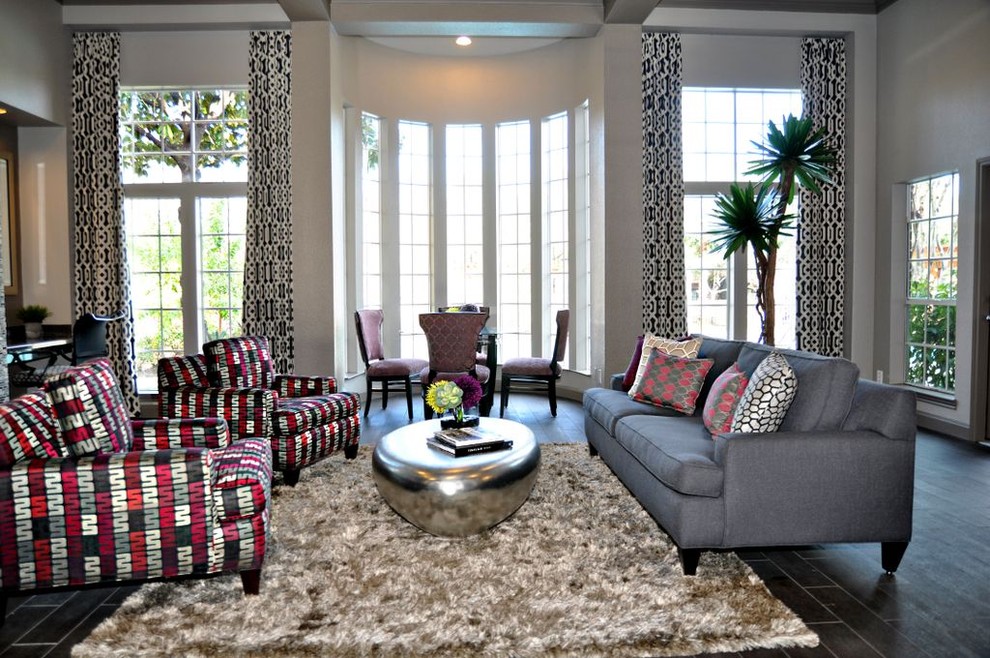 This is an example of a contemporary living room in Houston with white walls.