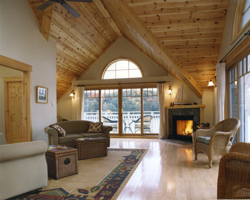 Example of a mid-sized mountain style formal and open concept light wood floor living room design in Toronto with beige walls, a corner fireplace, a stone fireplace and no tv