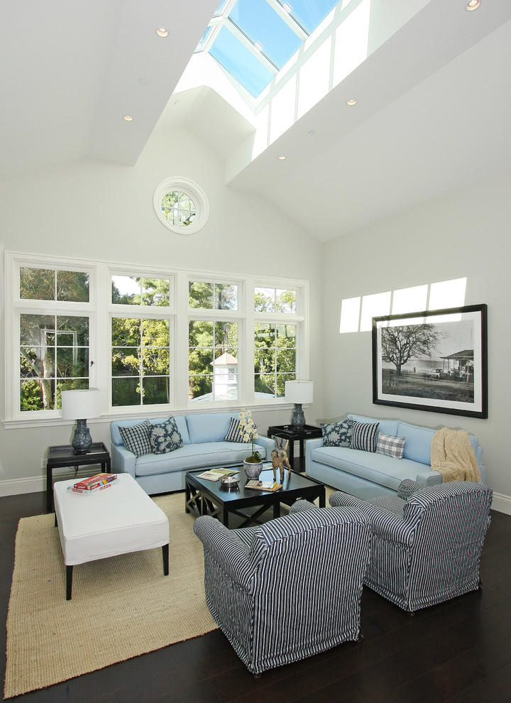 Example of a large classic formal and open concept dark wood floor living room design in Los Angeles with white walls