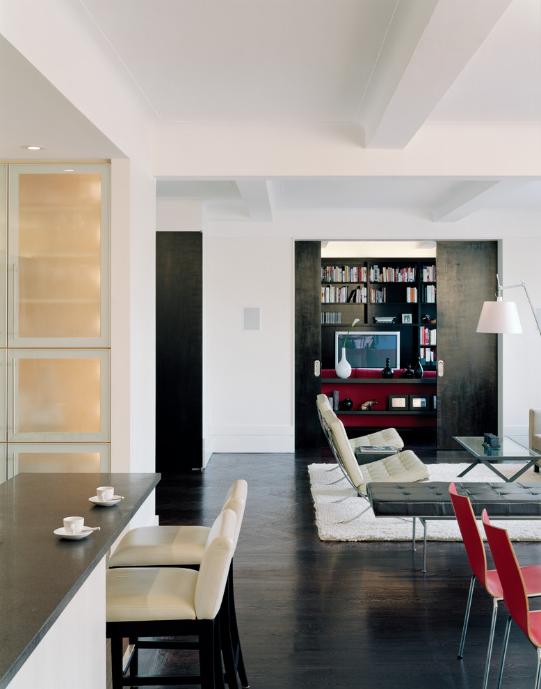 This is an example of a medium sized modern open plan living room in New York with white walls, dark hardwood flooring, no fireplace and no tv.