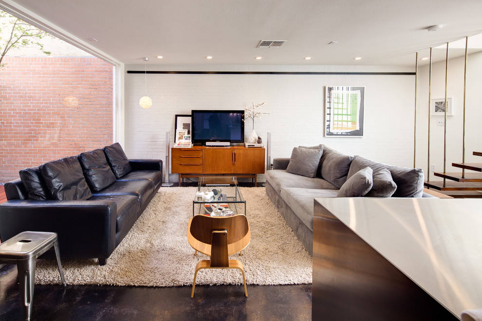 Idee per un soggiorno moderno aperto con TV autoportante