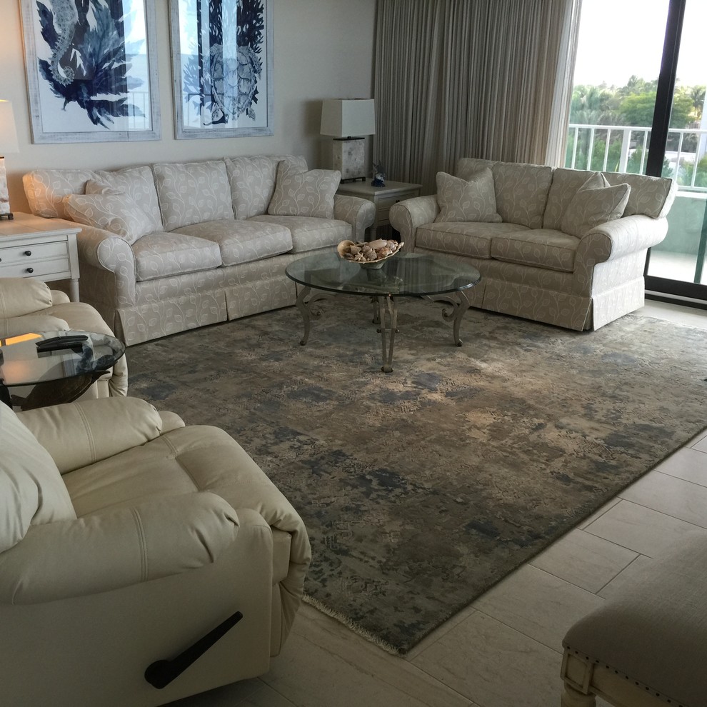 Large beach style open concept carpeted and beige floor living room photo in Tampa with beige walls and no fireplace