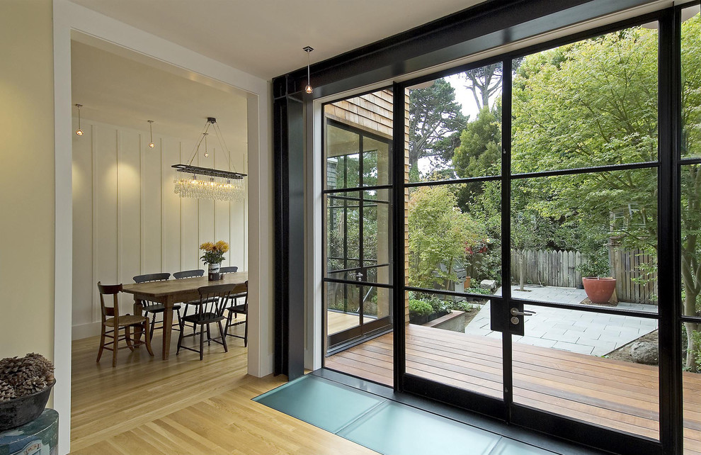 Living room - contemporary light wood floor living room idea in San Francisco with beige walls