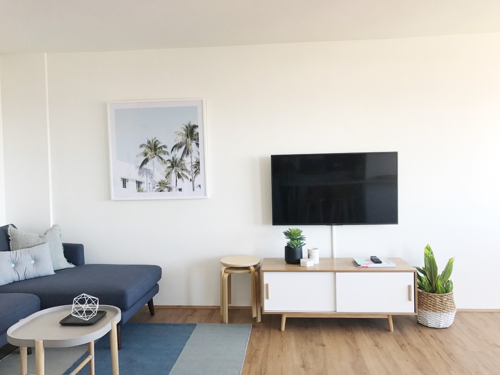 This is an example of a beach style living room in Sydney.