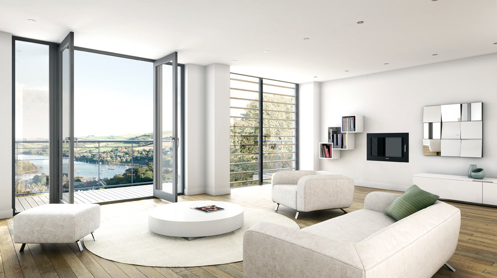 Großes, Repräsentatives, Offenes Modernes Wohnzimmer mit weißer Wandfarbe, braunem Holzboden, TV-Wand, Gaskamin und verputzter Kaminumrandung in Devon