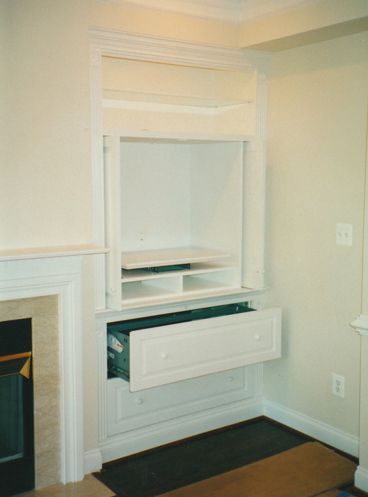 Example of a mid-sized classic formal and enclosed dark wood floor and black floor living room design in DC Metro with beige walls, a standard fireplace and a stone fireplace