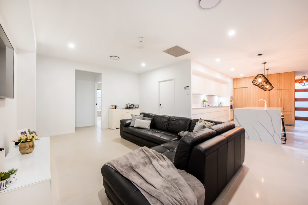 This is an example of a medium sized contemporary open plan living room in Other with white walls, ceramic flooring and white floors.