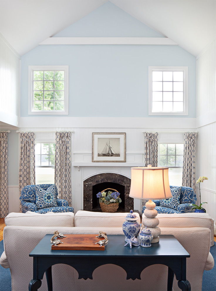 Inspiration for a timeless living room remodel in Baltimore with blue walls, a standard fireplace and no tv