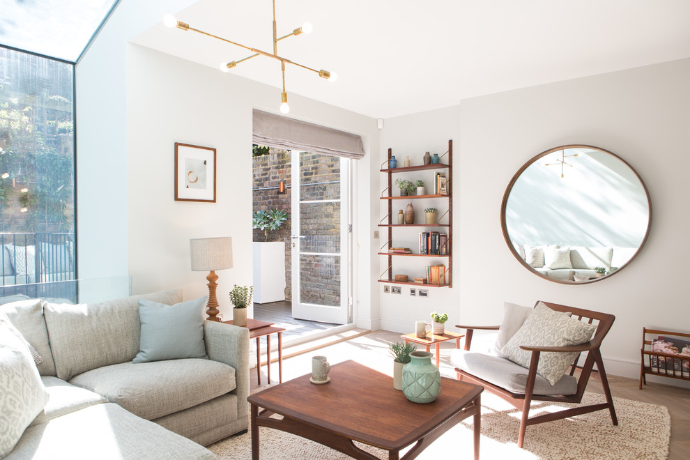 Classic living room in London with white walls and light hardwood flooring.