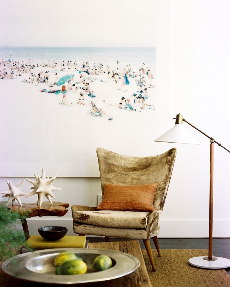 Example of a mid-century modern living room design in New York with white walls