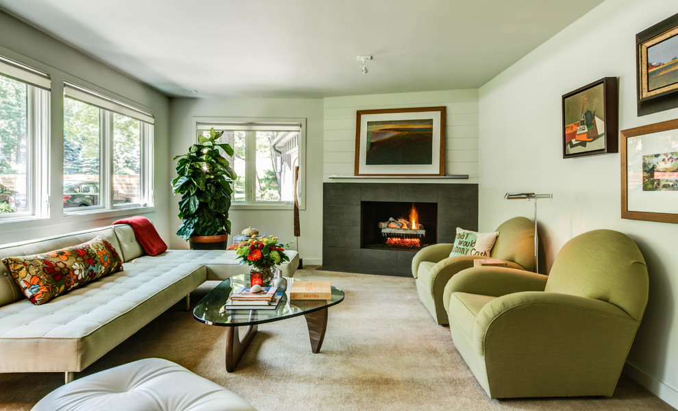 Example of a mid-sized 1960s formal and enclosed carpeted living room design in Grand Rapids with white walls, a corner fireplace and a stone fireplace