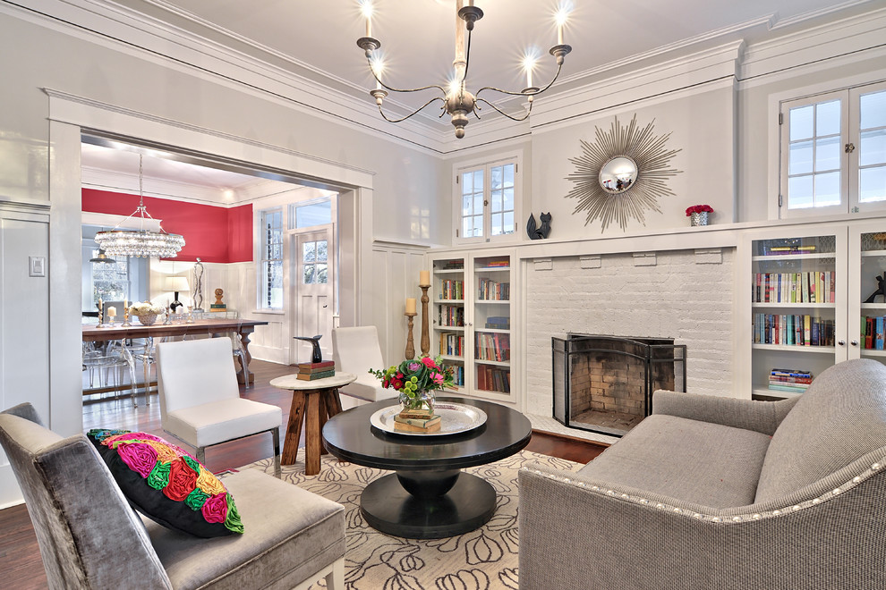 Example of an arts and crafts formal dark wood floor living room design in Austin with gray walls, a standard fireplace, a brick fireplace and no tv