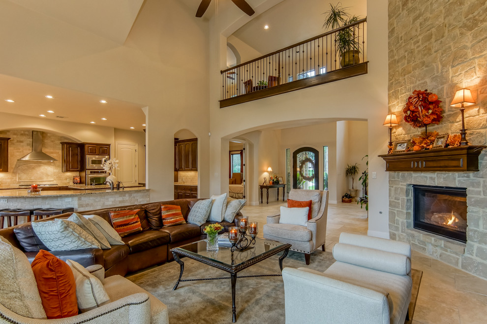 Example of a classic formal and open concept living room design in Austin with a standard fireplace and a stone fireplace