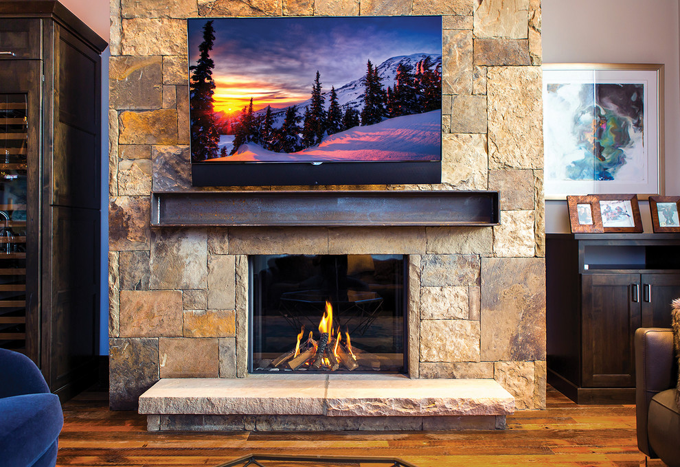 Inspiration for a contemporary brown floor living room remodel in Denver with a standard fireplace, a stone fireplace and a wall-mounted tv