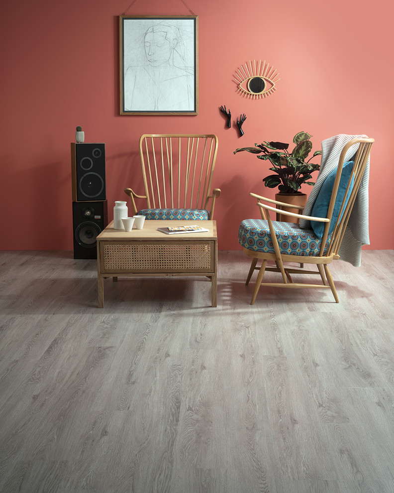 Foto di un soggiorno minimalista con pavimento in laminato e pavimento grigio