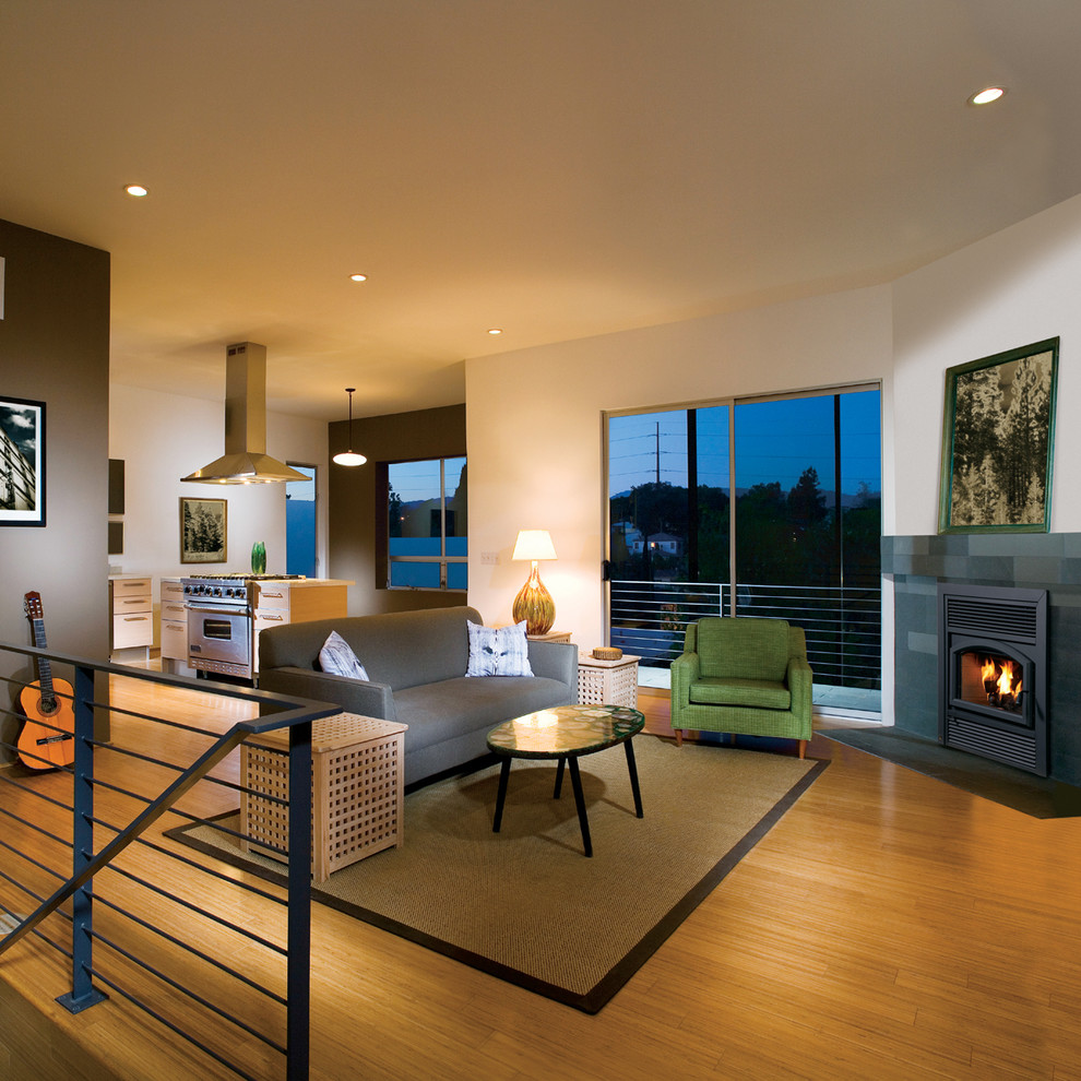 Elegant living room photo in Orange County with a standard fireplace