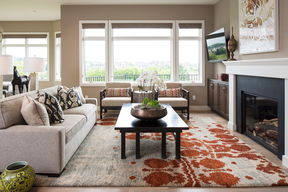 Living room - traditional formal medium tone wood floor living room idea in Minneapolis with brown walls, a standard fireplace and a wall-mounted tv
