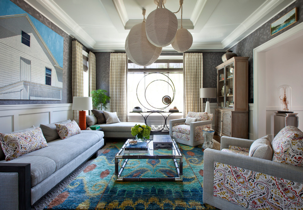Eclectic formal living room in New York with grey walls and carpet.