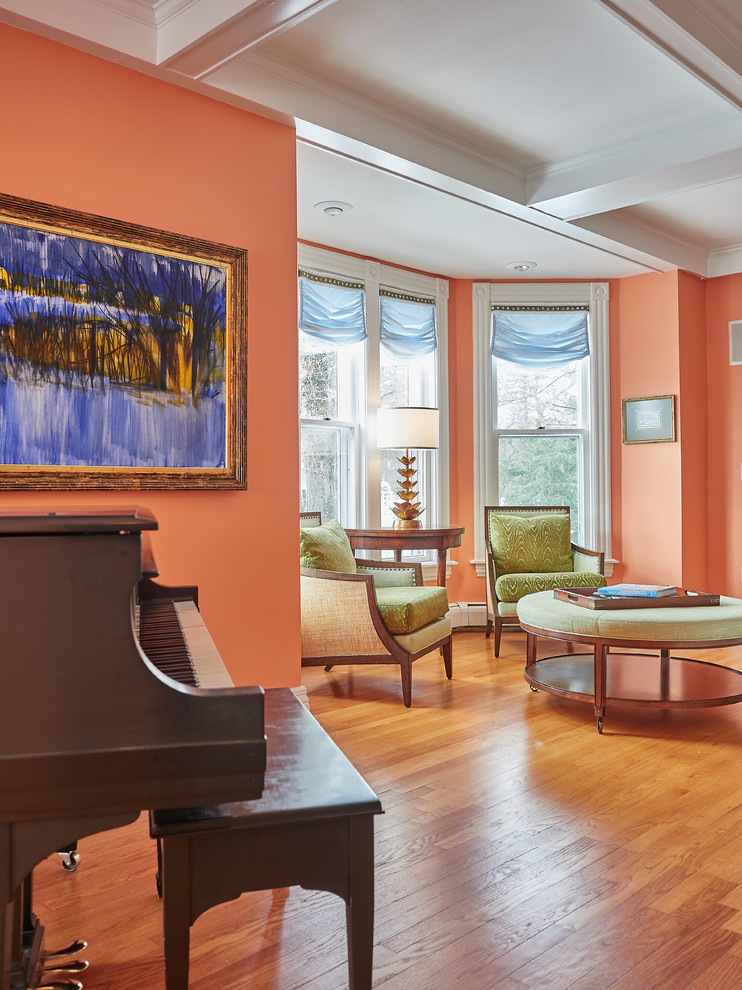 Пример оригинального дизайна: парадная, открытая гостиная комната среднего размера в классическом стиле с оранжевыми стенами, паркетным полом среднего тона, стандартным камином, фасадом камина из плитки и коричневым полом без телевизора