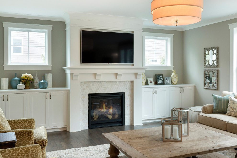 Example of a mid-sized transitional open concept medium tone wood floor living room design in Minneapolis with gray walls, a standard fireplace, a tile fireplace and a wall-mounted tv