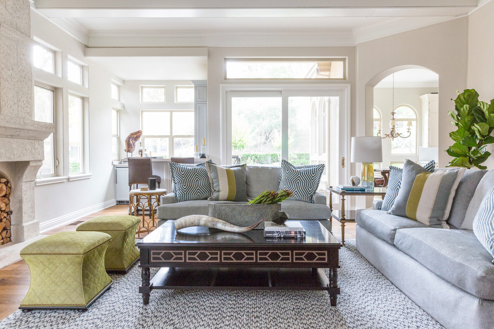 Living room - transitional medium tone wood floor and brown floor living room idea in San Francisco with beige walls