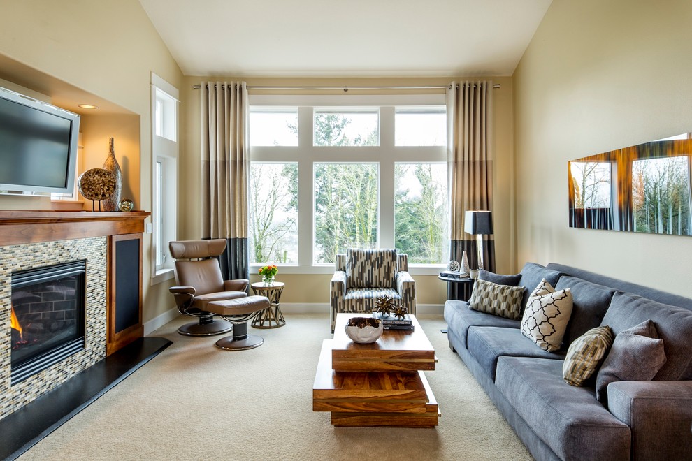This is an example of a contemporary living room in Portland with beige walls.
