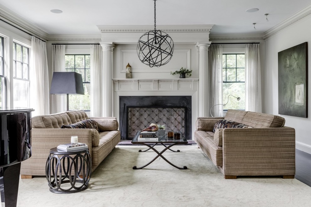 Design ideas for a traditional living room in Boston with grey walls, dark hardwood flooring, a standard fireplace and black floors.