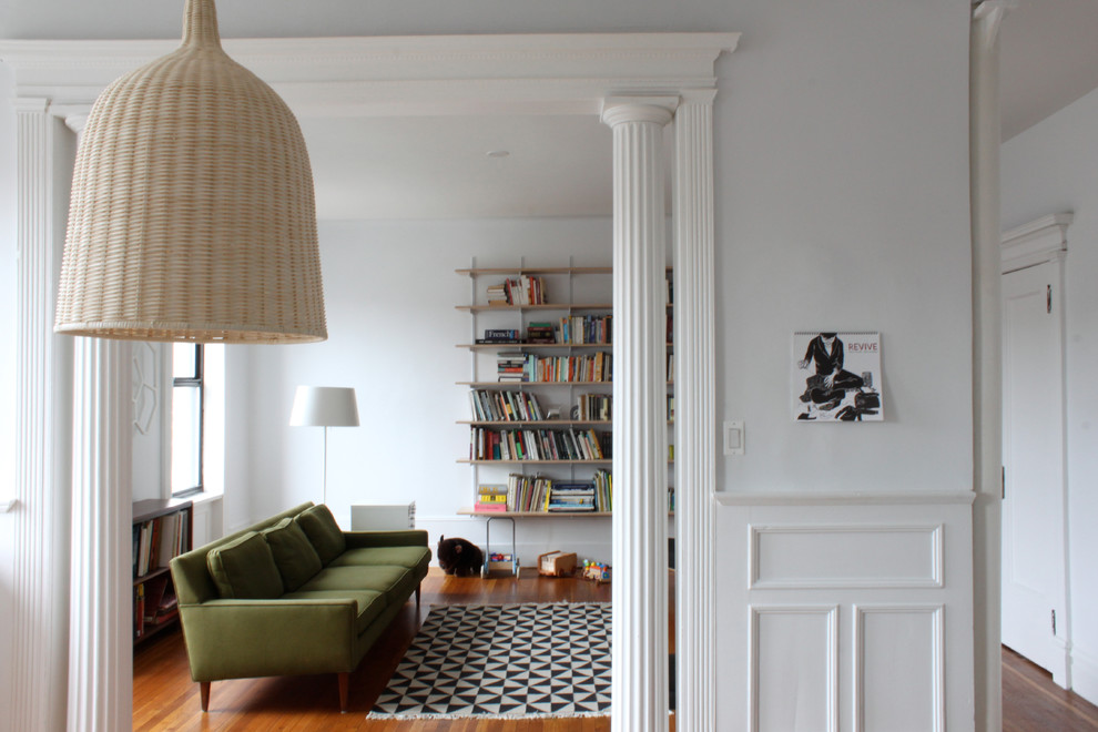 Minimalist living room photo in New York with white walls