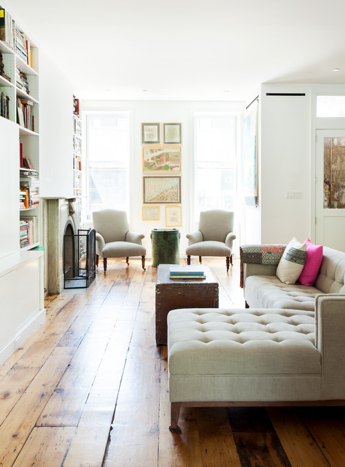New York living room with wood floors and soft grey upholstered sofa