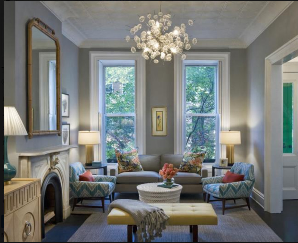 На фото: огромная парадная, открытая гостиная комната в классическом стиле с серыми стенами, ковровым покрытием, стандартным камином, фасадом камина из камня и серым полом