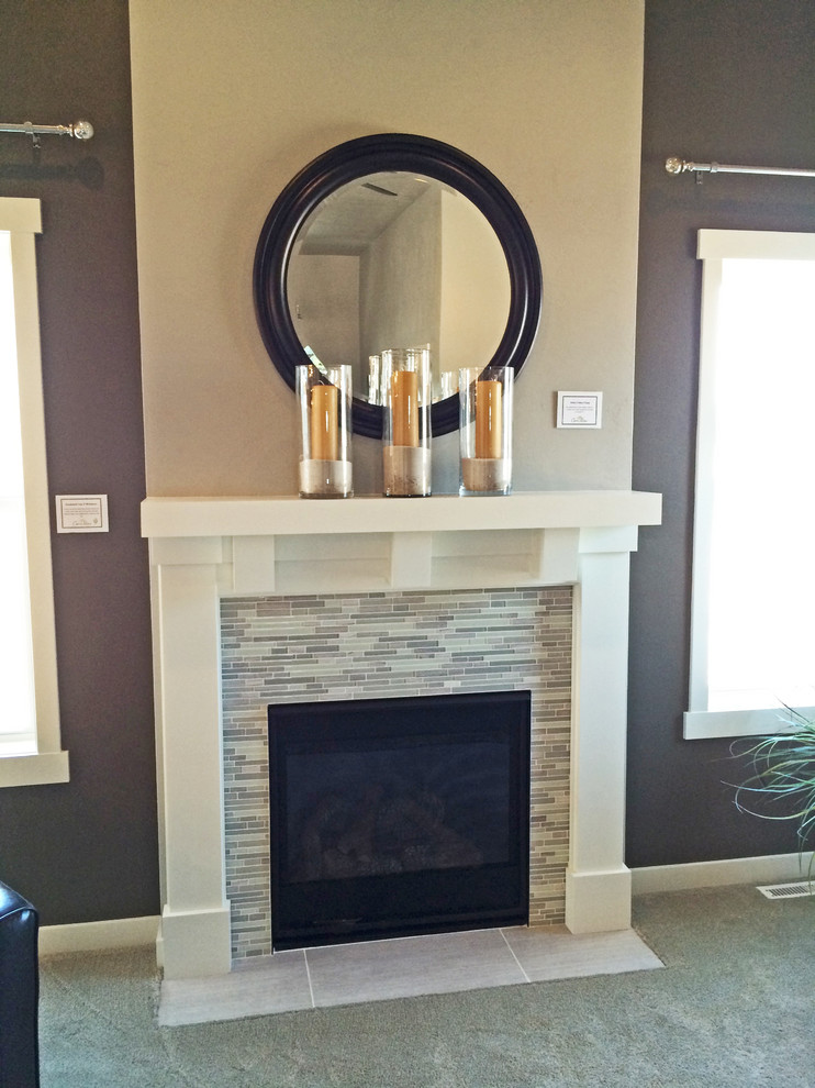Photo of a medium sized contemporary open plan living room in Milwaukee with grey walls, a standard fireplace and a tiled fireplace surround.