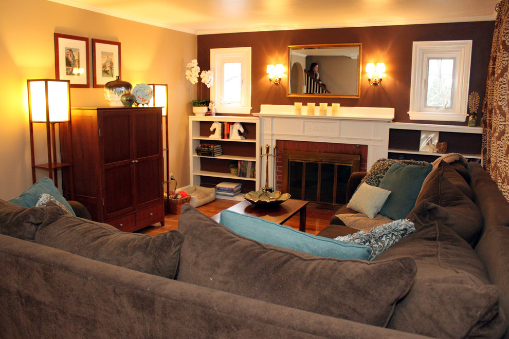 Example of a small eclectic enclosed light wood floor living room design in Boston with beige walls, a standard fireplace, a brick fireplace and a concealed tv