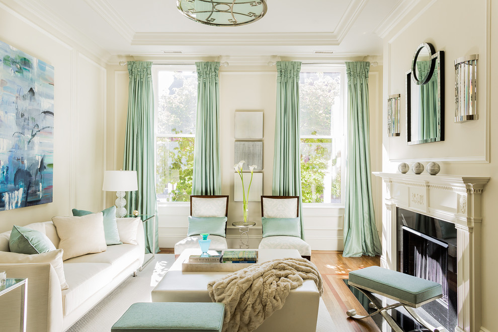 Transitional formal and enclosed medium tone wood floor living room photo in Boston with beige walls, a standard fireplace and no tv