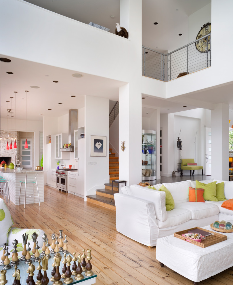 Trendy open concept beige floor living room photo in Portland with white walls