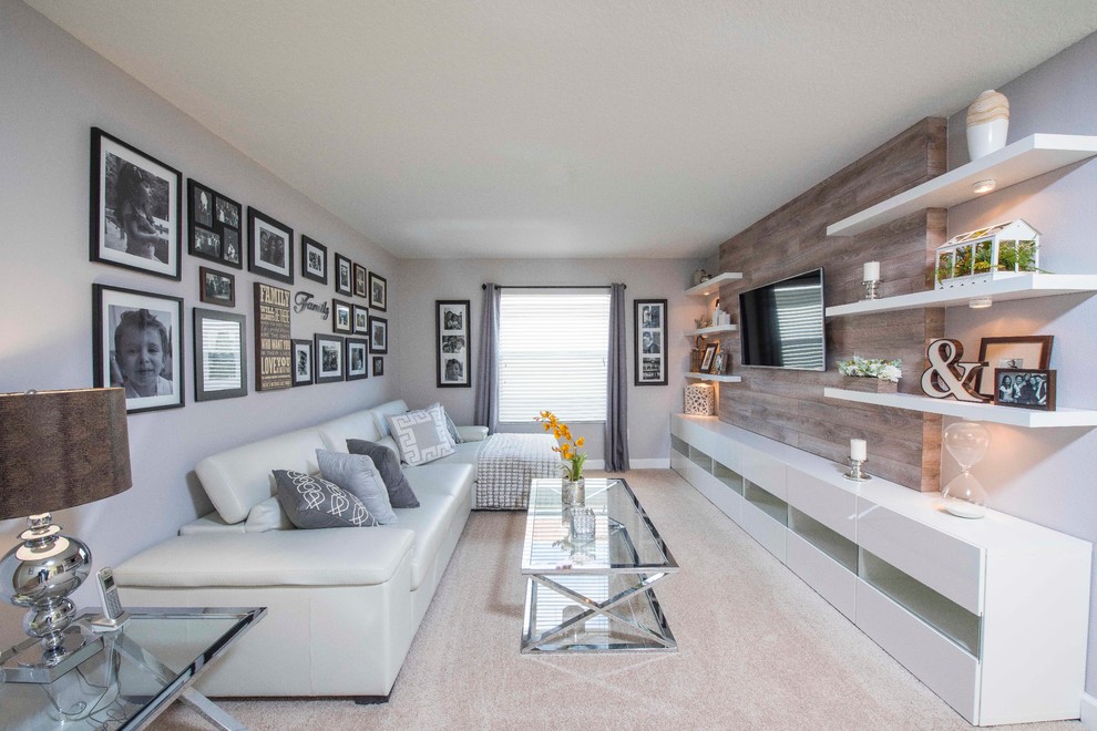 This is an example of a contemporary living room in Orlando with grey walls.