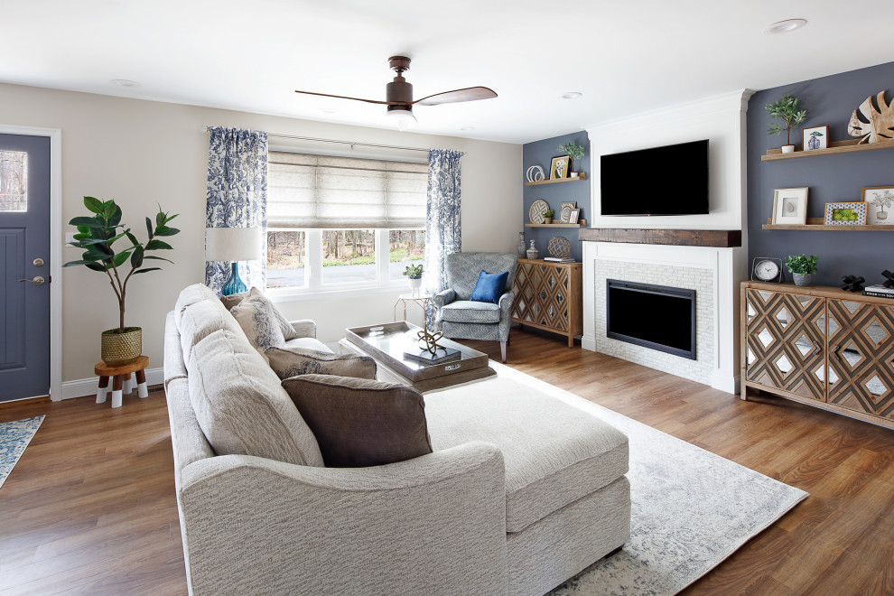 Inspiration for a transitional formal and open concept vinyl floor and brown floor living room remodel in Philadelphia with beige walls, a standard fireplace and a wall-mounted tv
