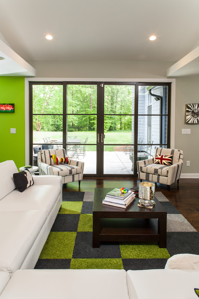 This is an example of a contemporary living room in Atlanta with green walls.